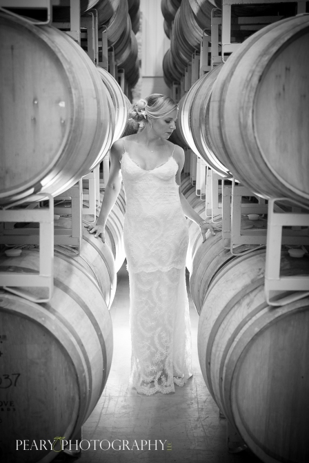 Bride with wine barrels